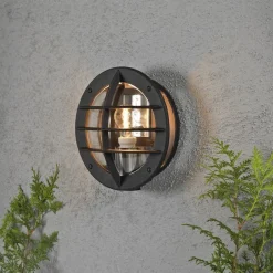 Oden vegglampe utendørs IP23 m/stikkontakt - Svart/klart glass